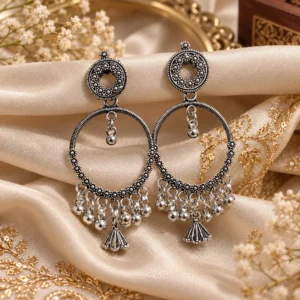 CHULKI Arohi oxidized hoop earrings with intricate detailing and dangling accents